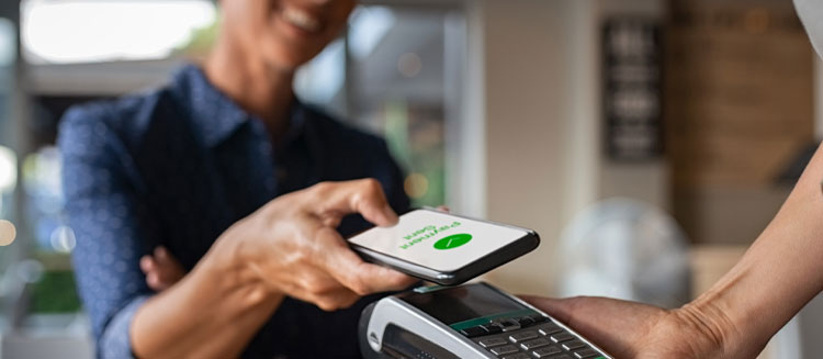 Women Paying Using Phone